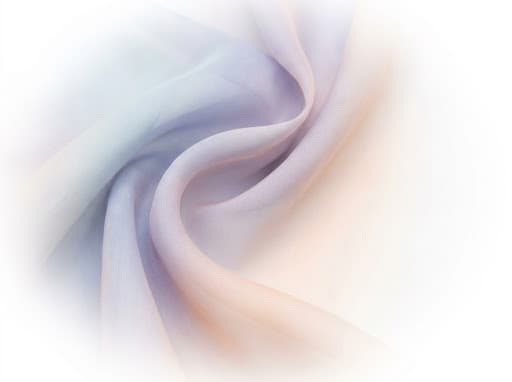 Soft flowing textile microfiber showing gradual ethereal color gradations and delicate weaving structure